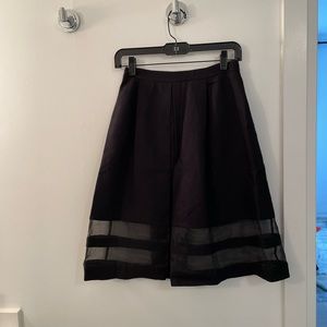 Club Monaco - Black mid length skirt with sheer cut outs and pockets